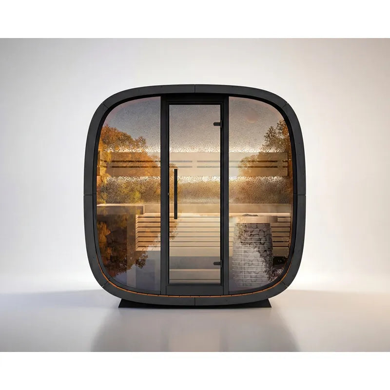 Leil Round Cube Mini – Gartensauna 4 Personen von Leil Saunas mit rundlicher Würfelform, Glastüren und Holzbänken im Innenraum