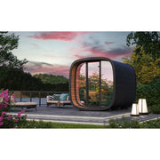 Leil Round Cube Mini – Gartensauna 4 Personen von Leil Saunas mit schwarzem Außendesign und großem Glasfenster, installiert in modernem Gartenambiente bei Sonnenuntergang
