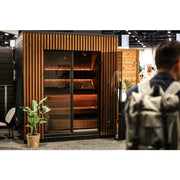 Leil® Viva 210 Gartensauna 4 Personen mit Liege von Leil® Saunas auf Messe, Holzfassade mit vertikalem Design
