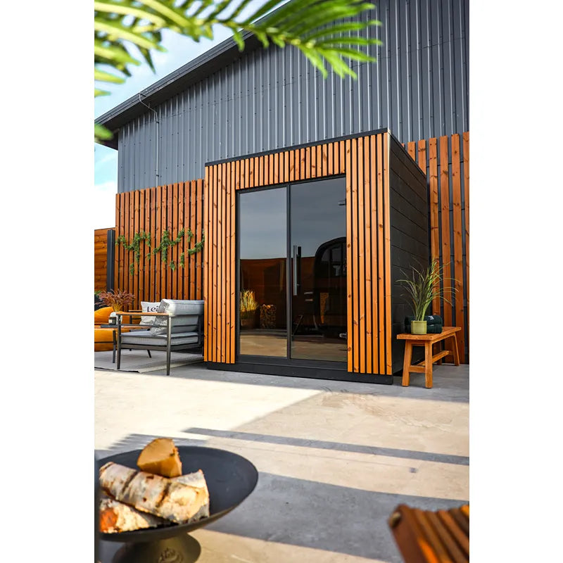 Leil® Viva 210 Gartensauna 4 Personen mit Liege von Leil® Saunas im modernen Gartendesign mit orangeholz-Verkleidung