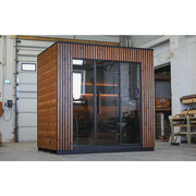 Leil® Viva 250 Gartensauna 4 Personen XL mit Glasfront von Leil® Saunas in Werkstatt, Holzfassade mit Glasfront