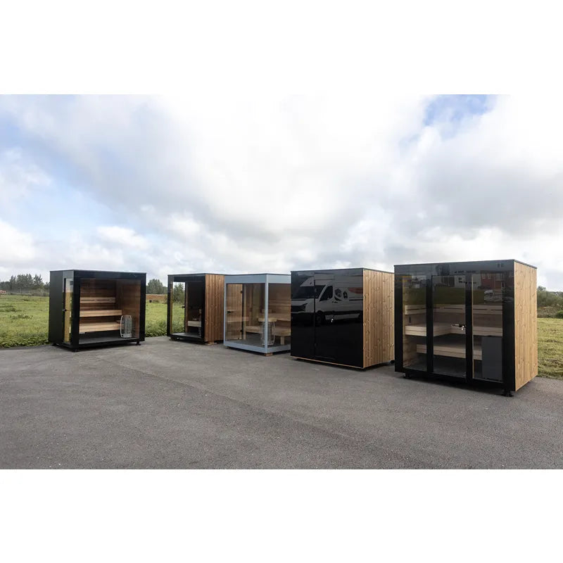 Nordik Wellness Signature L Premium-Gartensauna für Familien mit Holzverkleidung und Glaselementen in Gartenumgebung