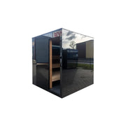 Nordik Wellness Signature M Kompakte Luxus-Gartensauna mit schwarzem Rahmen, Glastüren und Holzinnenausstattung im Garten