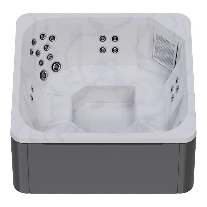 Novitek M-0 Outdoor Whirlpool in Weiß mit grauem Sockel, Draufsicht mit Massagedüsen und Lufteinlässen