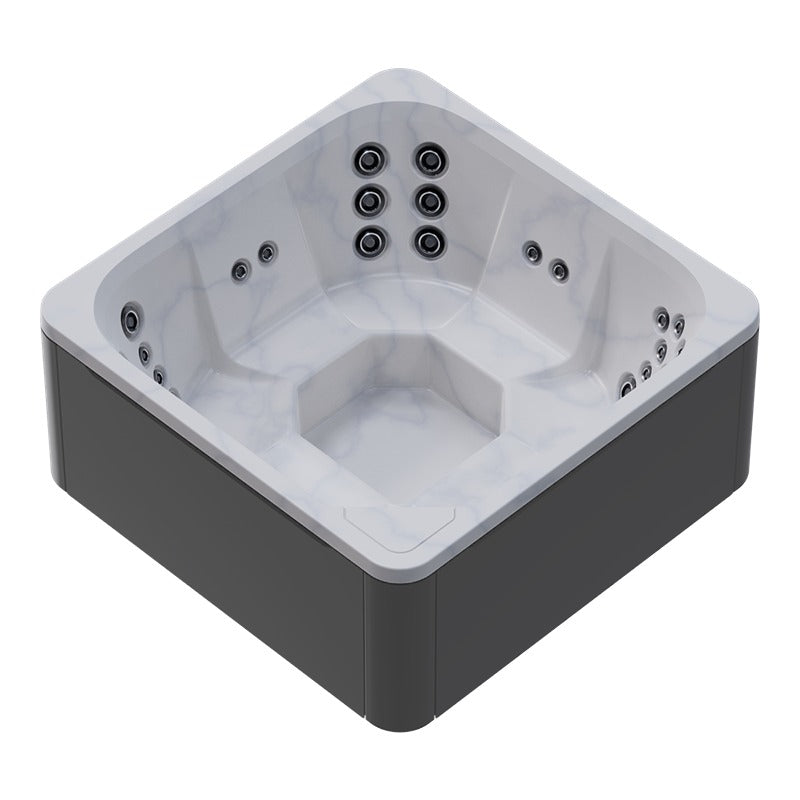 Novitek M-0 Whirlpool mit weißem Innenaufbau und dunkelgrauem Außenpaneel von oben, ausgestattet mit mehreren Massagedüsen an allen Seiten