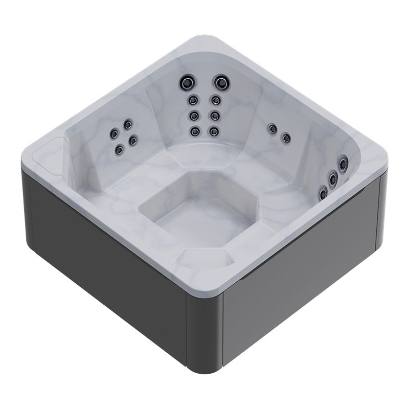 Novitek M-0 Outdoor Whirlpool mit weißem Wanneninneren, grauen Außenwänden und mehreren Massagejets an allen Seiten, Draufsicht