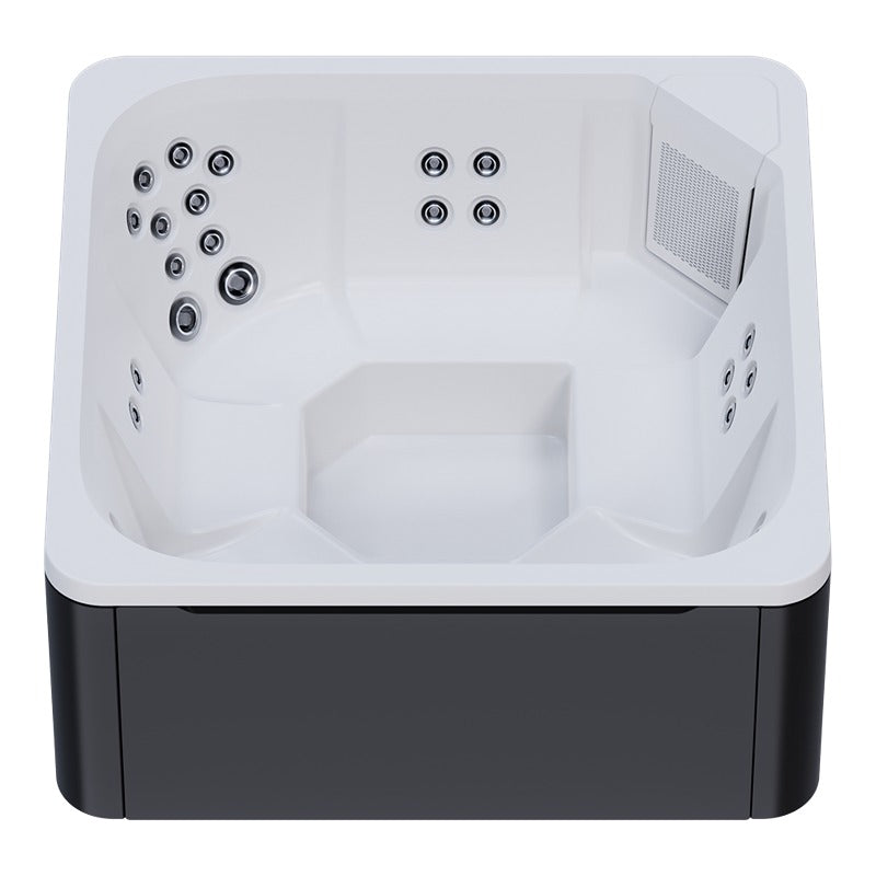 Novitek M-0 Outdoor Whirlpool von oben, weiße Innenausstattung mit mehreren Massagedüsen an den Seiten, schwarzes Außengehäuse, Platz für 7 Personen