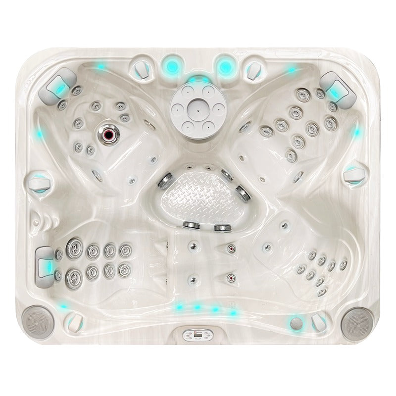 Passion Spas Happy Whirlpool von oben mit großzügiger Platzaufteilung, leuchtenden LEDs und Massagedüsen in cremefarbener Ausführung