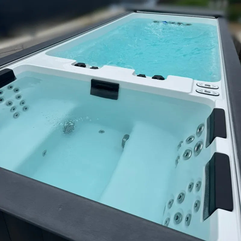 Passion Spas Whirlpool Balance 600x228x138 cm - 4 Personen mit türkisblauem Wasser und Massagedüsen im Garten