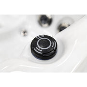 Platinum Spas Happy Whirlpool – Nahaufnahme des schwarzen ON/OFF-Drehreglers auf weißer Acryloberfläche