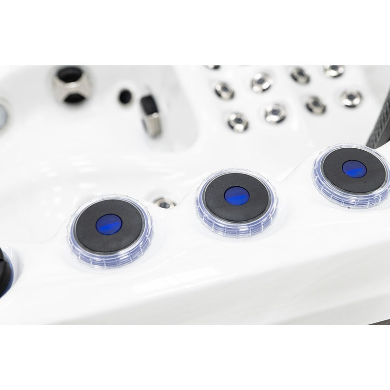Platinum Spas Happy Whirlpool – blaue Drehregler zur Steuerung der Fontänen auf weißem Acrylrand
