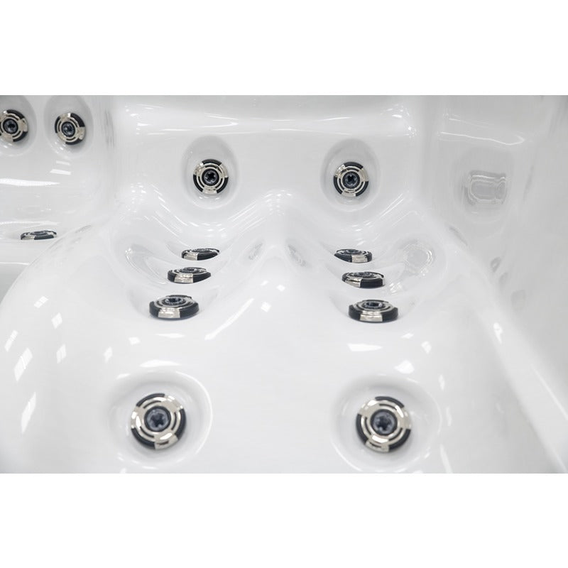 Platinum Spas Palma Whirlpool mit ergonomischem Lounger und gezielten Massagedüsen für Beine und Rücken