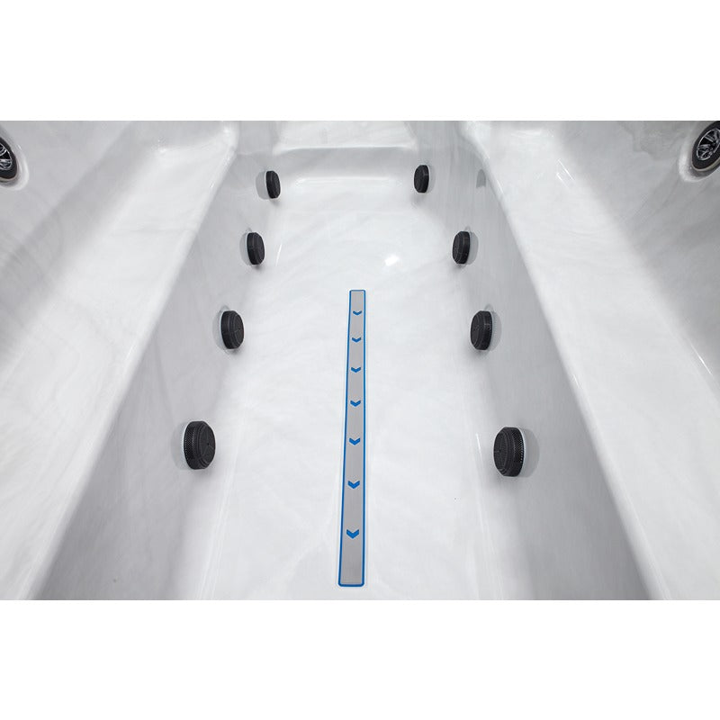 Detailed view of the swimming area in the Platinum Spas Titan Swim Spa with lateral hydrojets and marked swimming direction for optimum counter-current training