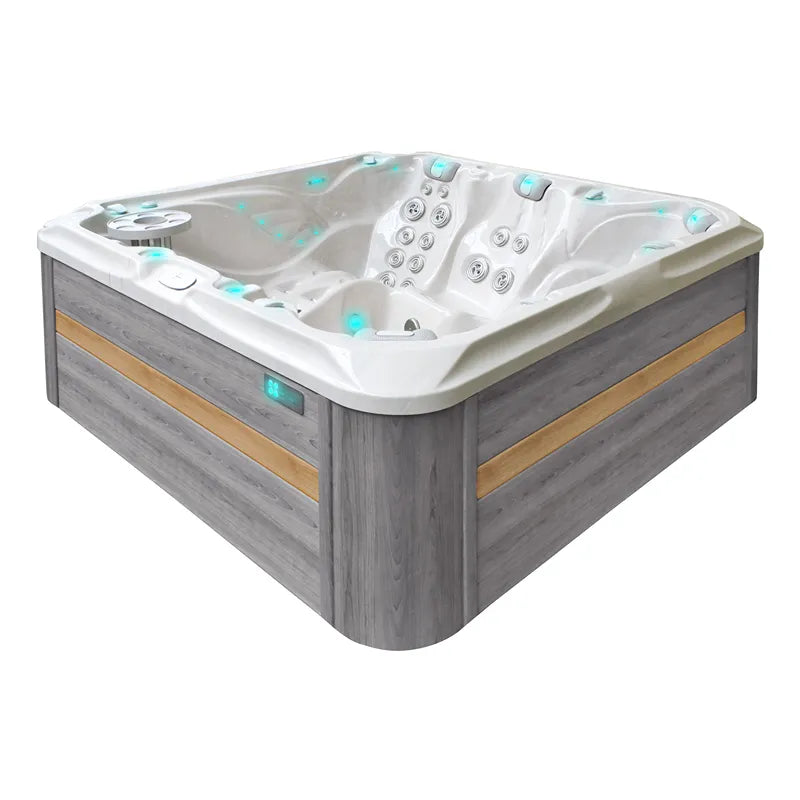 Passion Spas Admire Whirlpool für 6 Personen mit weißem Becken, grauer Holzverkleidung und integrierten Massagedüsen sowie Steuerungspanelen