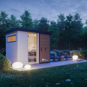 Savne Štrus Gartensauna Garden – Finnisch/BIO Sauna im Garten bei Dämmerung mit Holzverkleidung