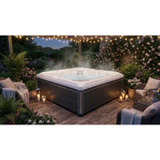 Wellis Makalu Life Premium Whirlpool mit 5 Sitzen in eleganter Gartenumgebung, umgeben von Blüten und Beleuchtung