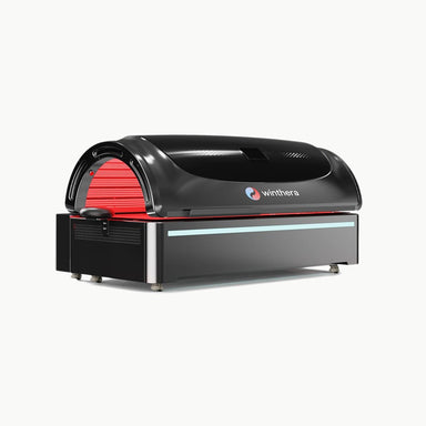 Winthera Red Bed – schwarze Lichttherapie-Liege mit roter LED-Aktivierung, schräge Vorderansicht